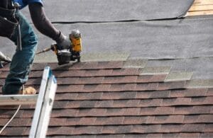 Roof contractor repairing a roof