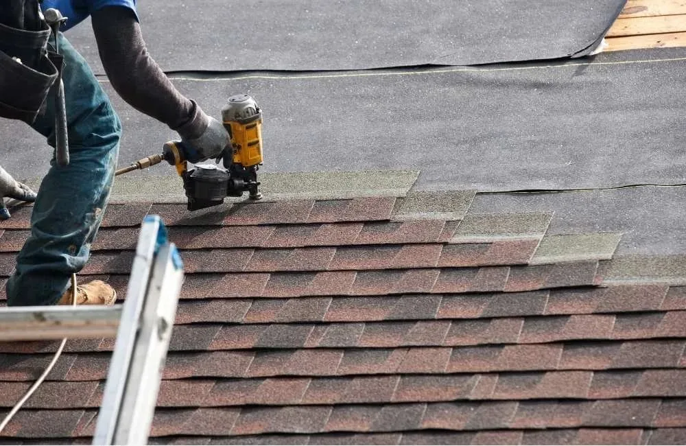 Roof contractor repairing a roof